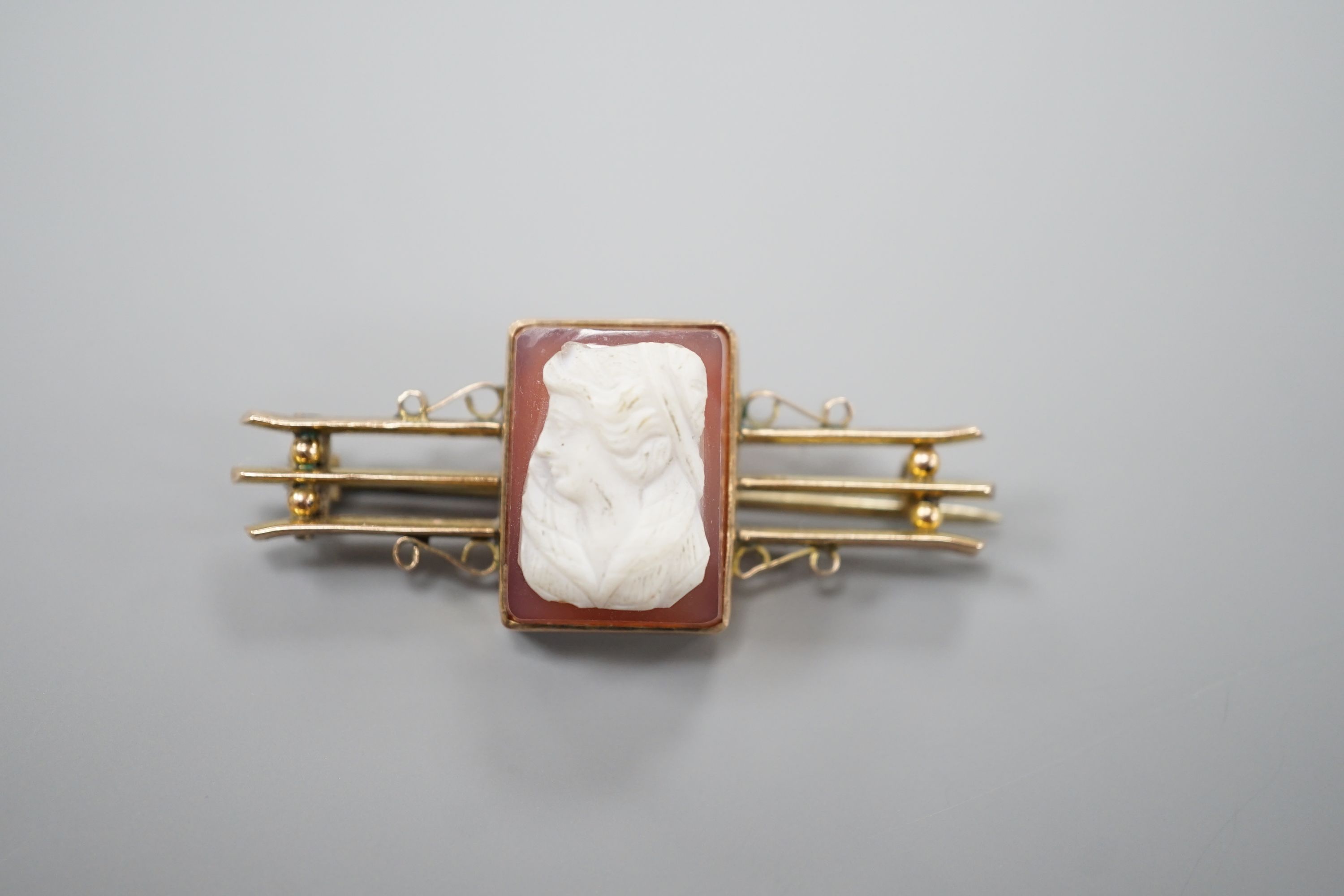An early 20th century 9cy and sardonyx square cameo set bar brooch, carved with the bust of a lady to dexter, 45mm, gross weight 7.6 grams.